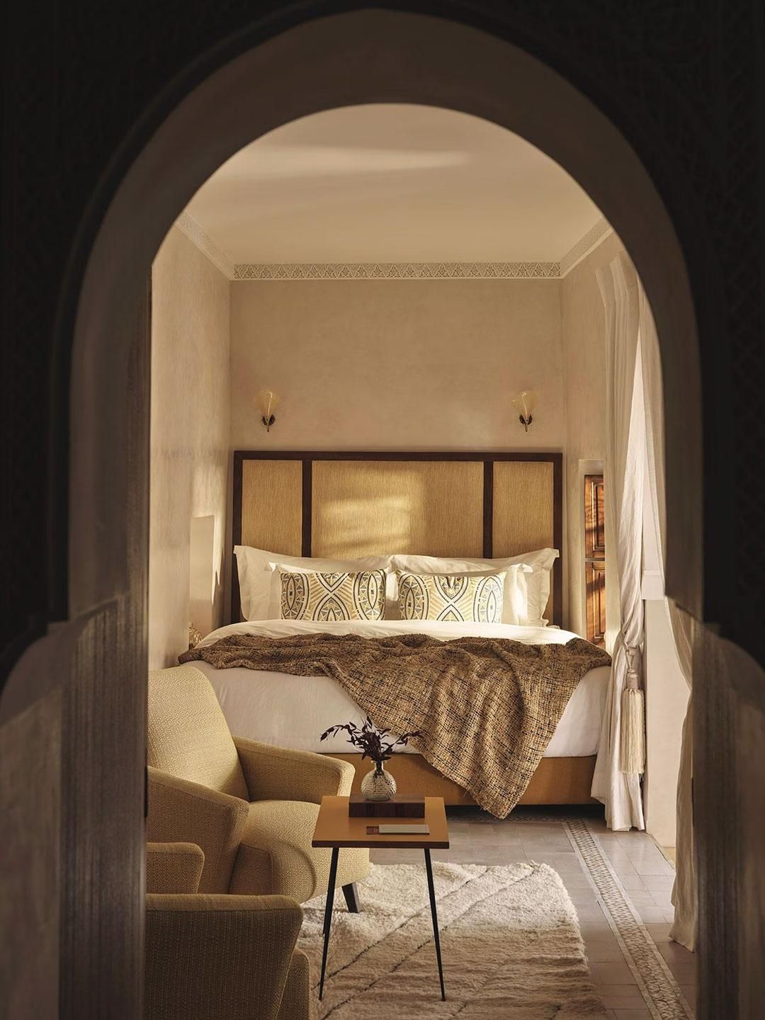 Bedroom through arched doorway