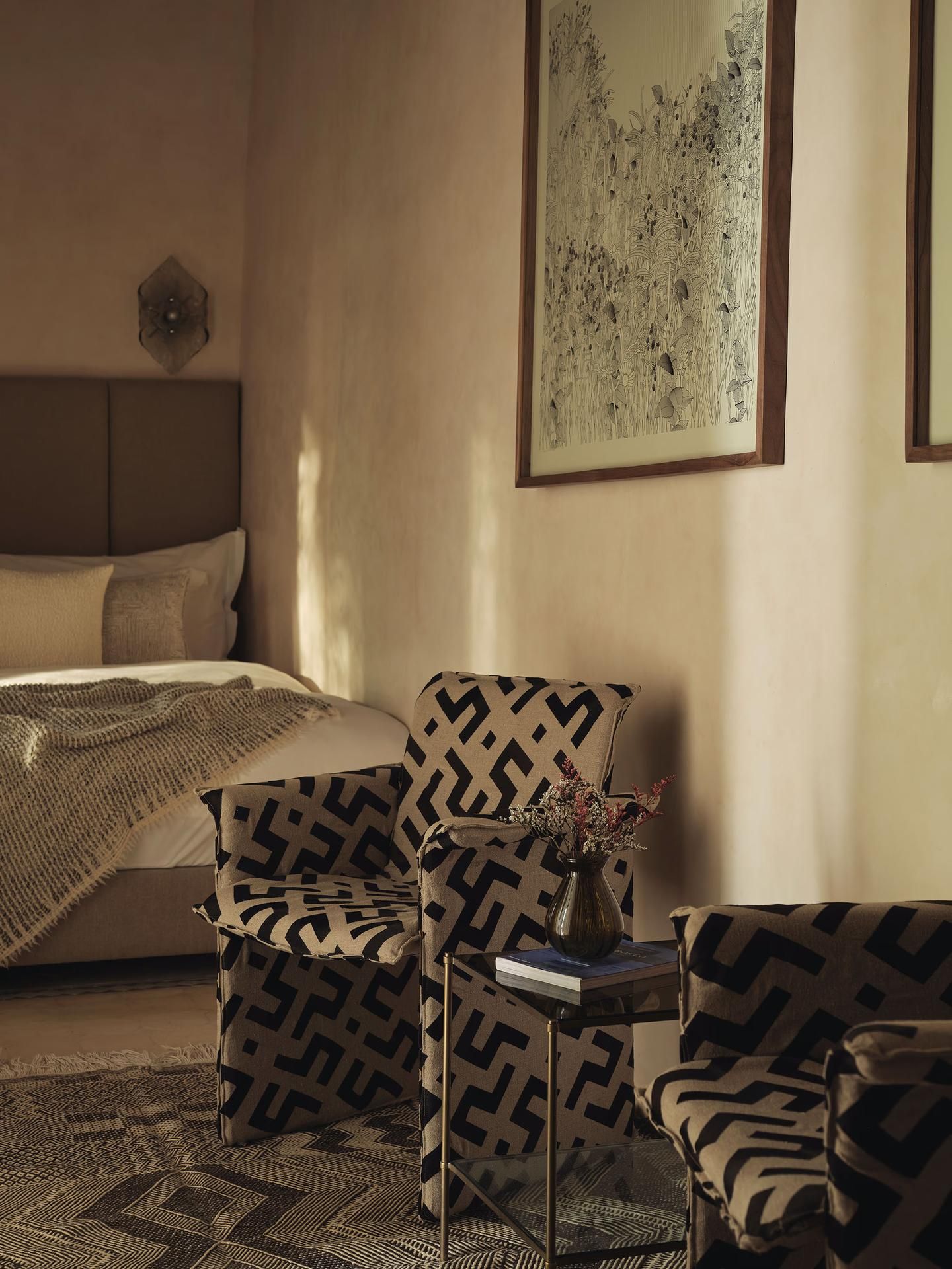 Bedroom corner with patterned armchairs