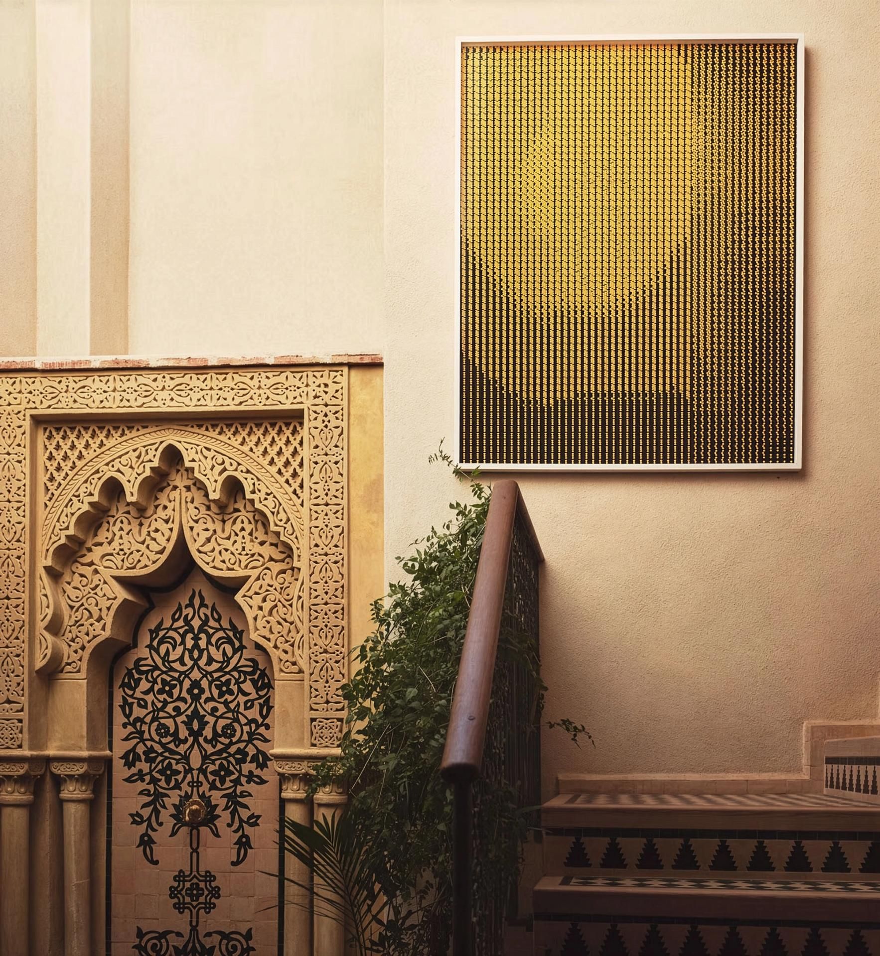 Stucco fireplace niche with golden artwork