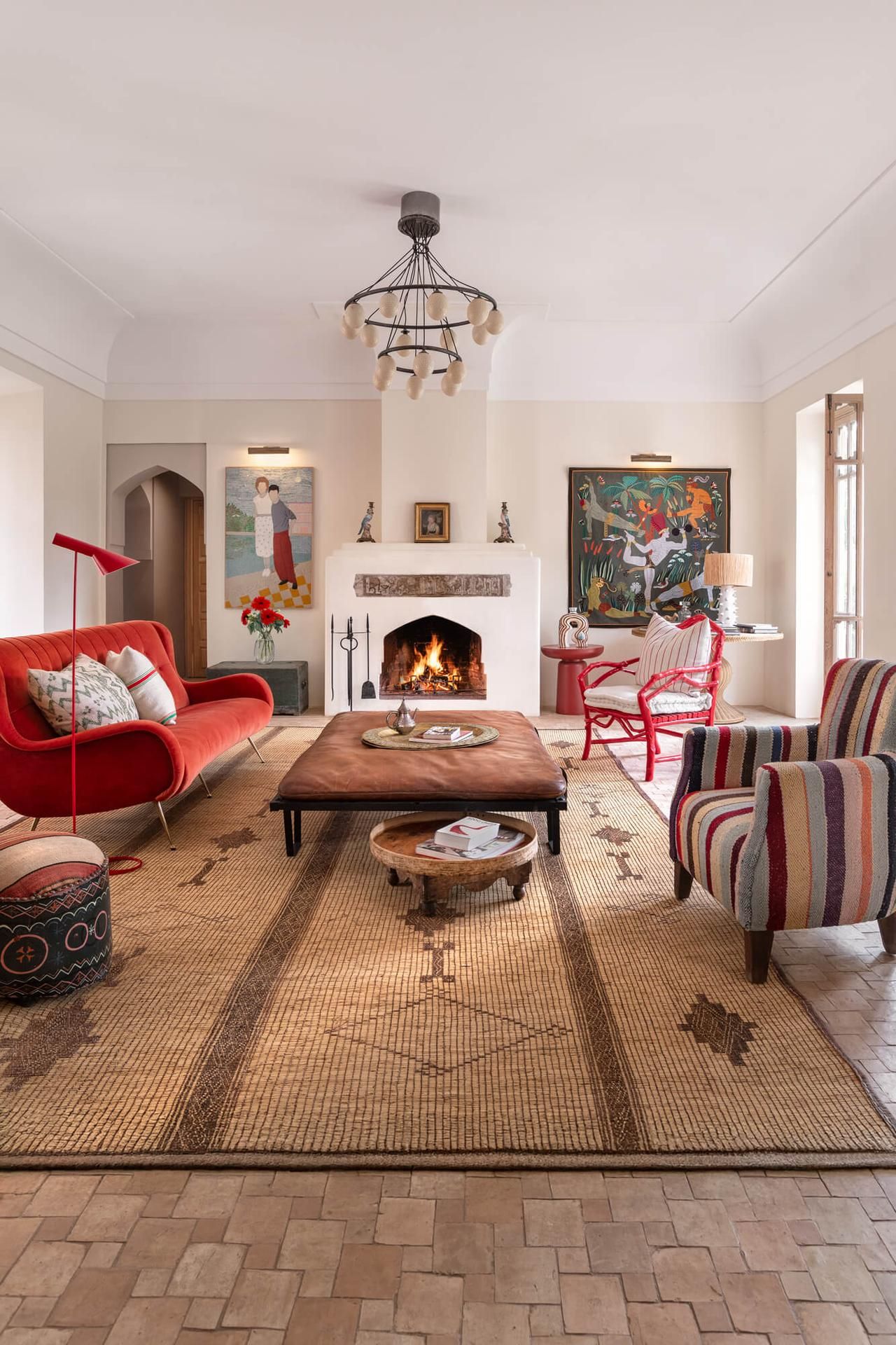 Living room with fireplace and paintings