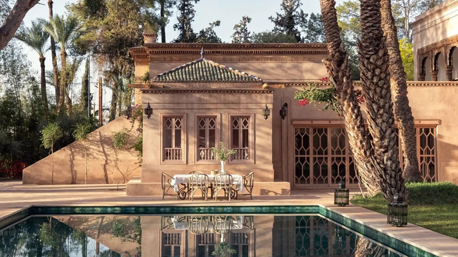 Villa facade reflected in pool