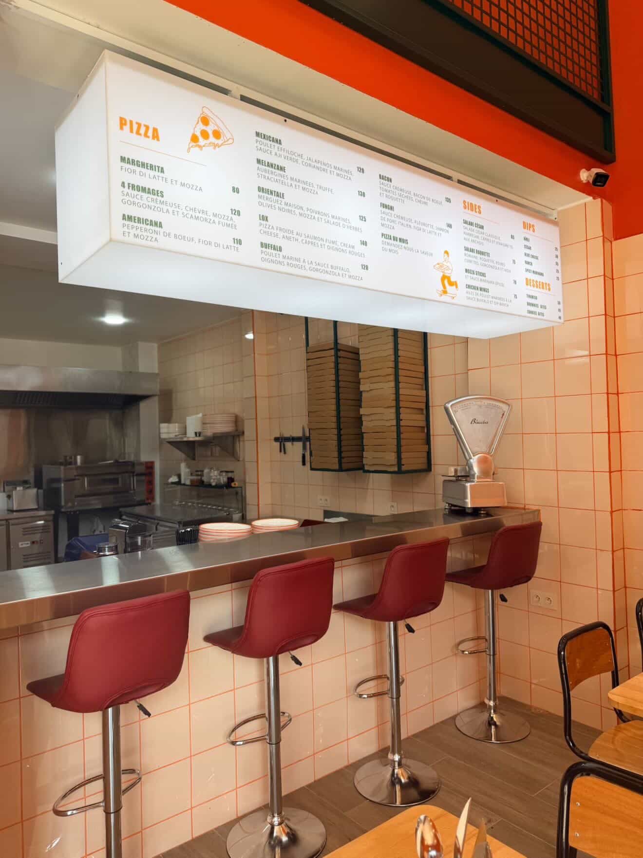 The counter and menu board at Pizzaclub in Semlalia
