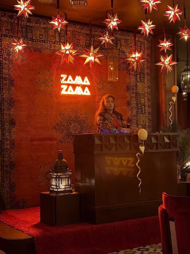 The Zama Zama neon sign in the room