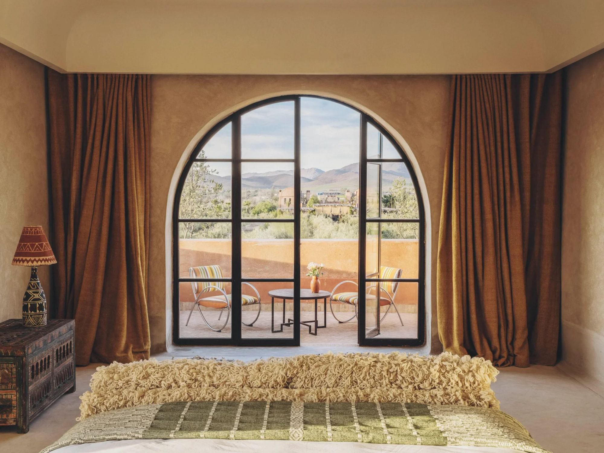 Every Ranch House room frames the Atlas through a soaring arched window
